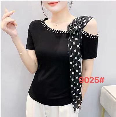 Elegant black tee with pearl embellishments and a polka-dot sash.