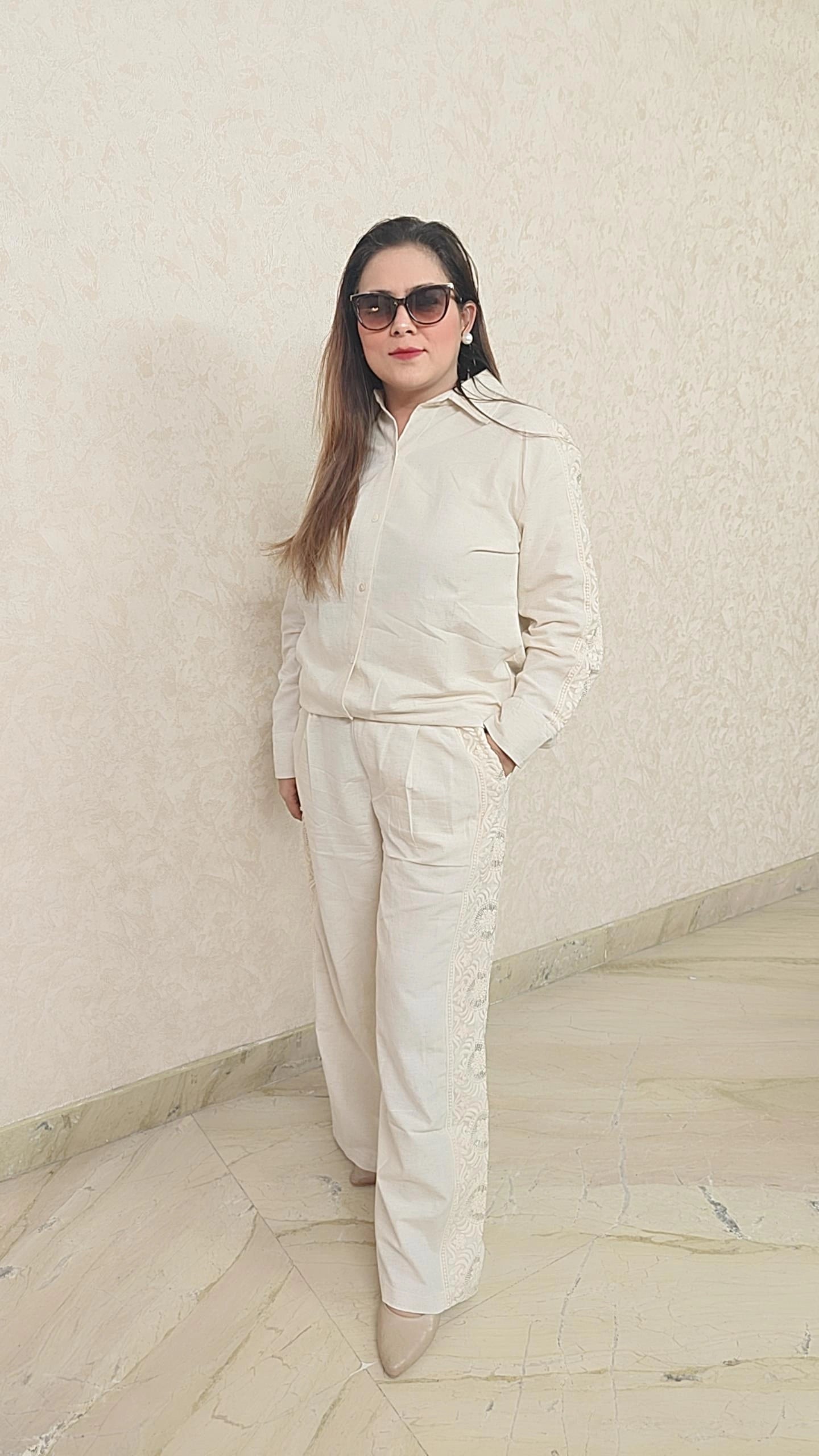 Elegant off white cord Set with sequence work on bottom