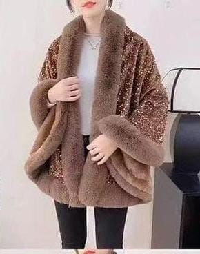 Luxurious and cozy—this fur-trimmed sequin cape