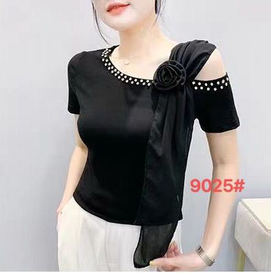 Elegant black tee with pearl embellishments and a polka-dot sash.