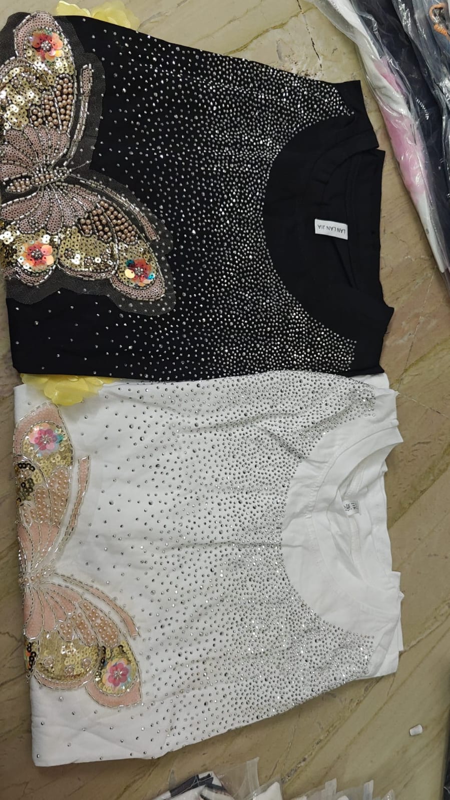 Premium butterfly emblessihed top