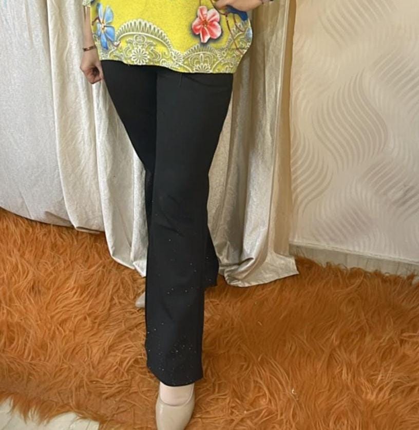 "Black Flared Pants with Subtle Sparkle Detail"