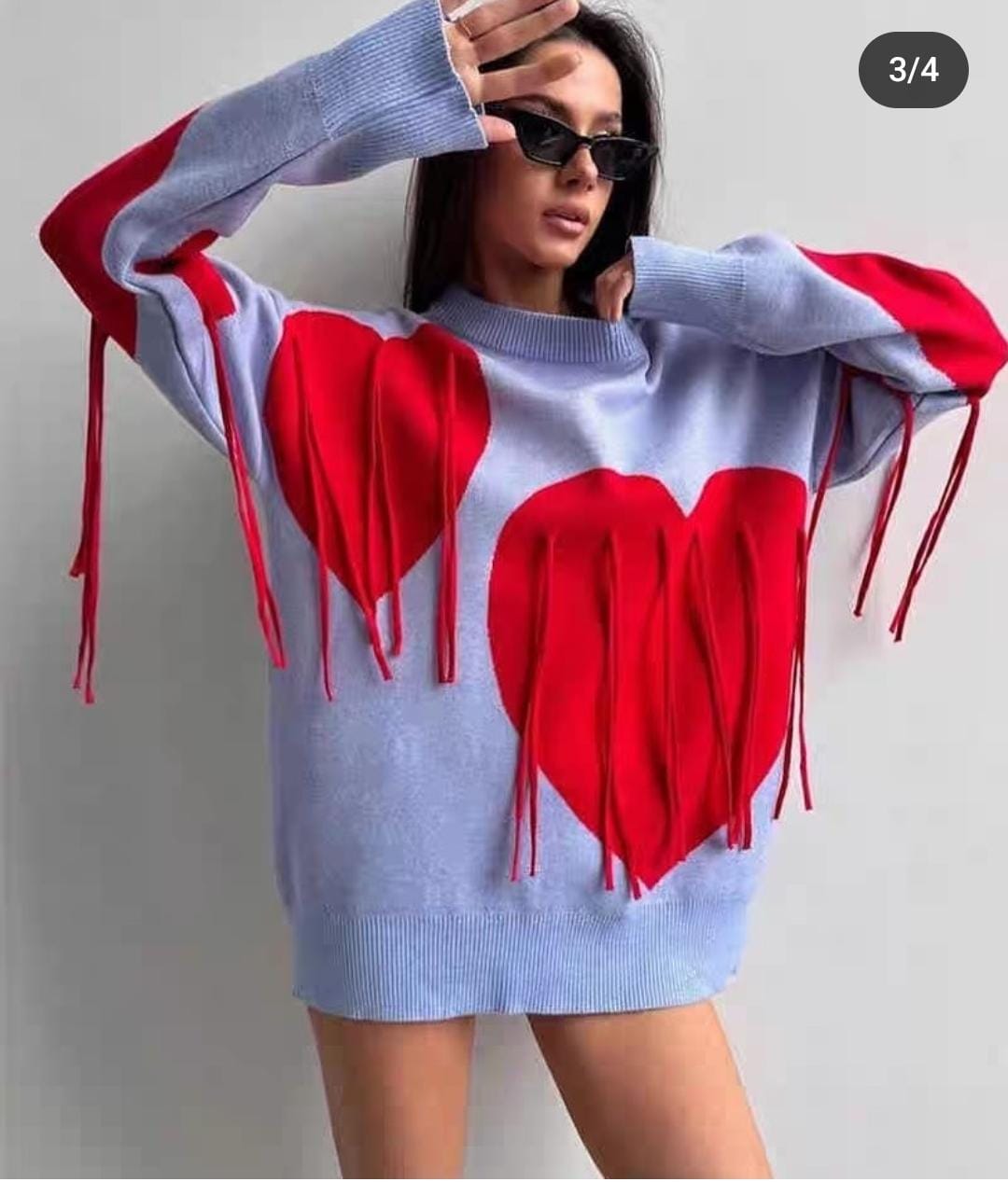 Cozy and bold  statement heart-fringe pullover
