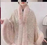 Luxurious and cozy—this fur-trimmed sequin cape