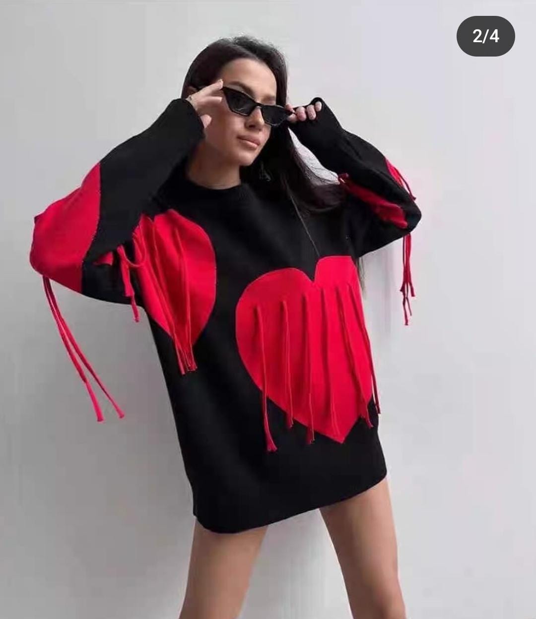 Cozy and bold  statement heart-fringe pullover