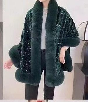 Luxurious and cozy—this fur-trimmed sequin cape