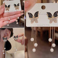Butterfly Pearl Dangle Earrings – Graceful & Chic